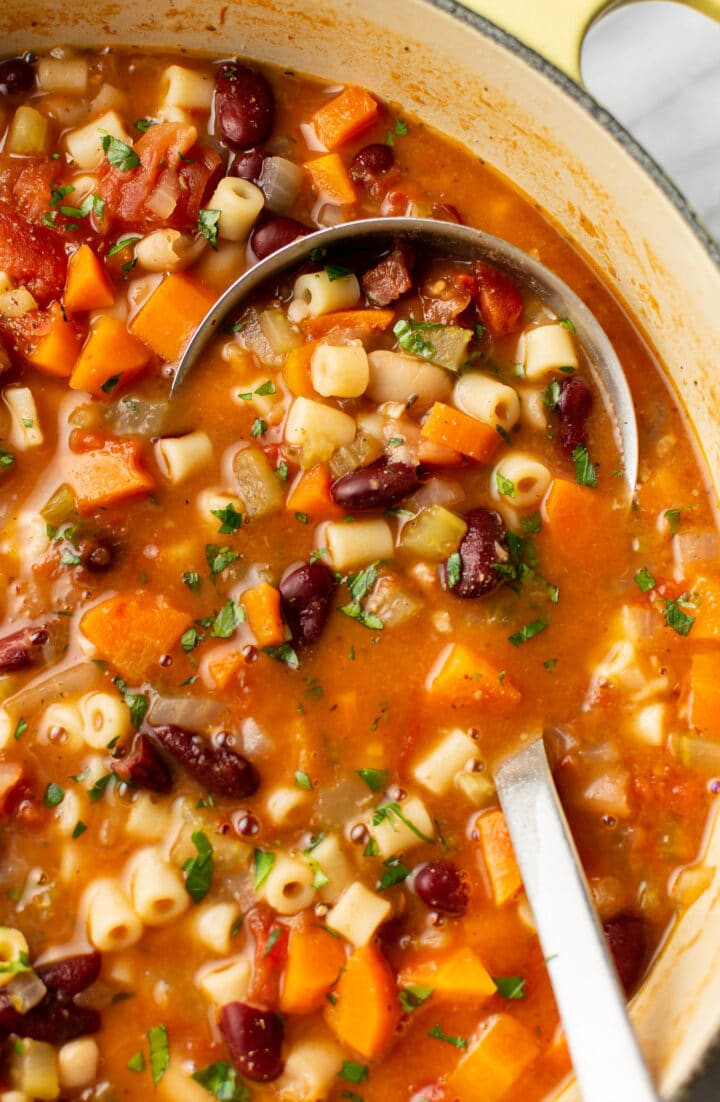 close-up of a ladle in a pot of soup