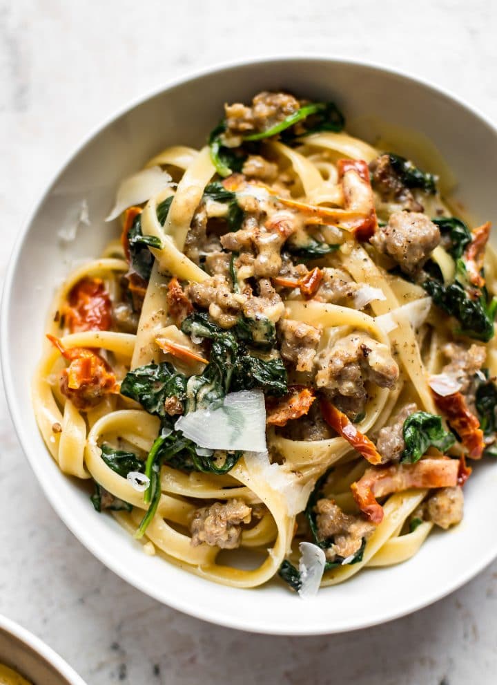 This creamy Tuscan sausage pasta is loaded with the good stuff like garlic, sun-dried tomatoes, spinach, basil, lemon, and Italian sausage. The sauce is amazing and you'll want seconds!