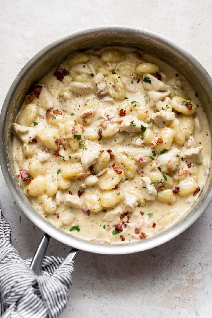 metal skillet with easy chicken bacon gnocchi with a cream sauce