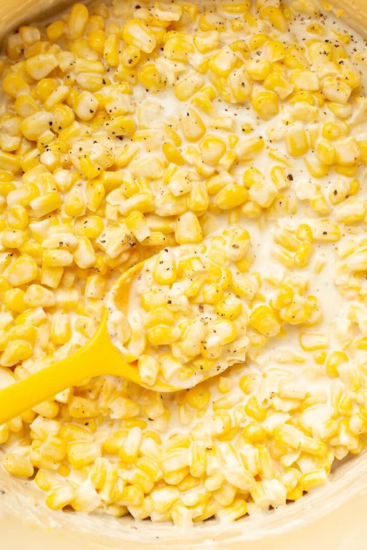 closeup of creamed corn with a spoon