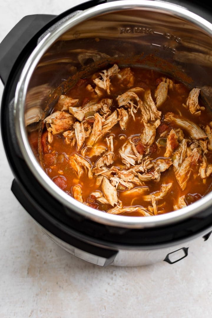 an Instant Pot filled with shredded chicken for tacos