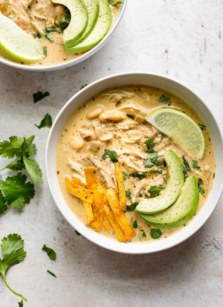 This creamy white chicken chili is easily made in your Instant Pot! Time to dust off the electric pressure cooker for this fabulous and flavorful recipe.