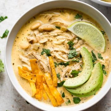 This easy white chicken chili is made fast and easy in the Instant Pot. It's quick enough for a weeknight dinner, and the whole family will love to customize their toppings.