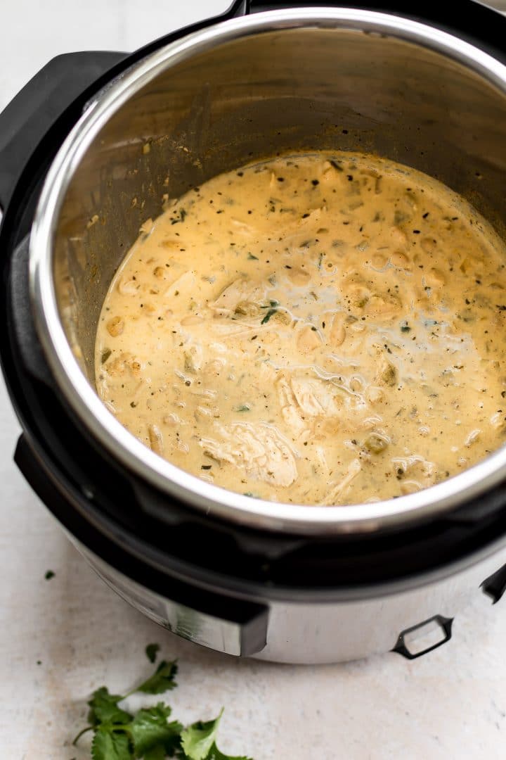 an Instant Pot electric pressure cooker filled with creamy white chicken chili
