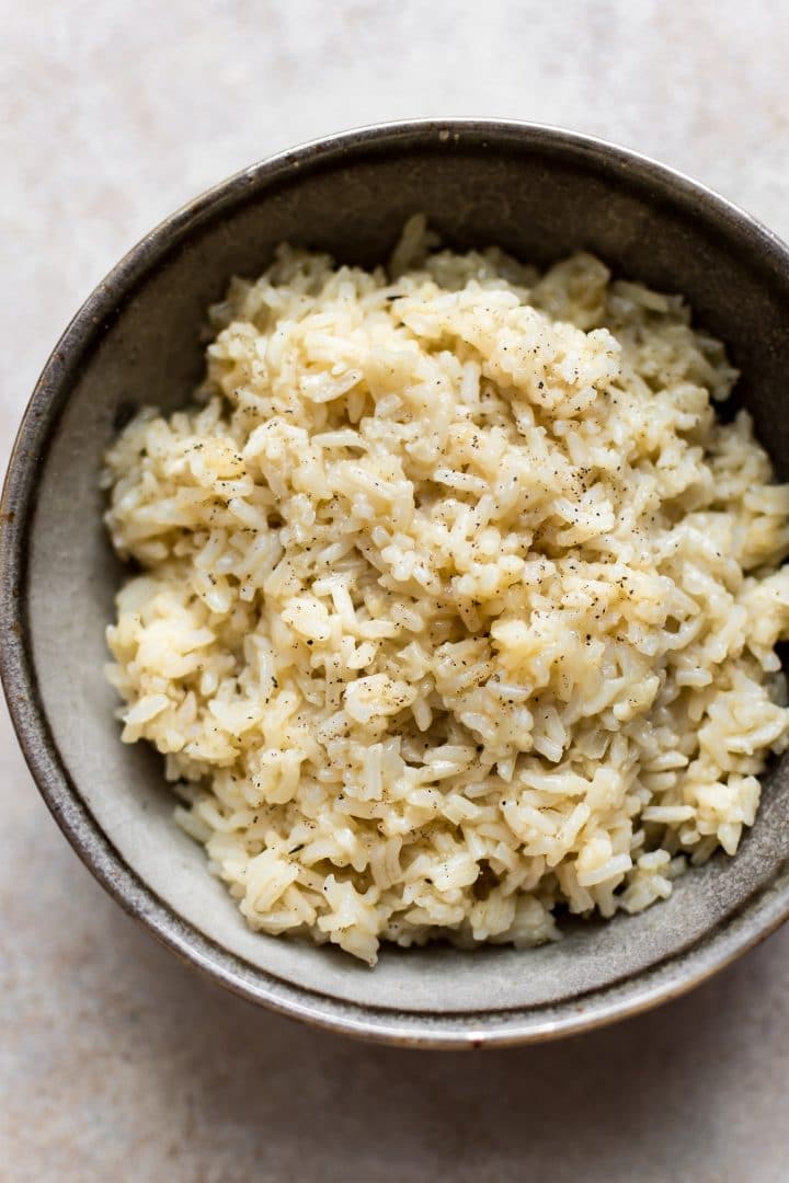 Instant Pot savory and creamy rice in an earthenware bowl close-up