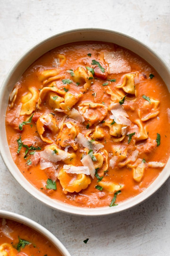 easy tomato tortellini soup made with canned tomatoes in a white bowl