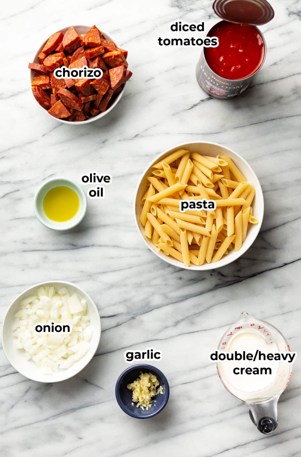 ingredients for chorizo pasta in prep bowls