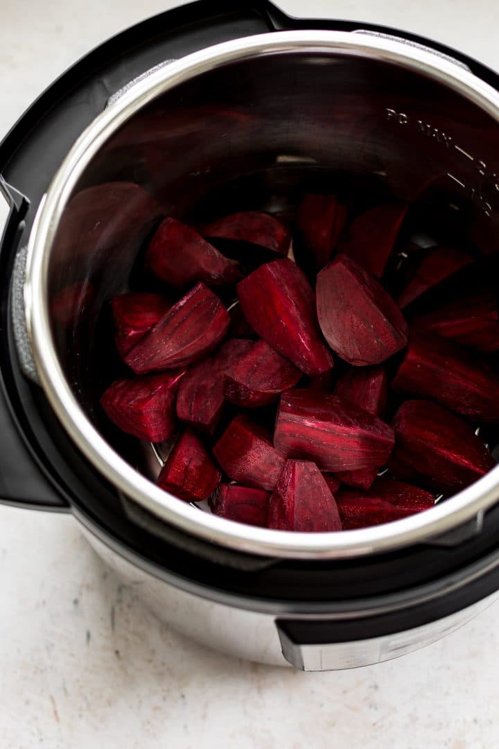 an Instant Pot filled with sliced raw beets