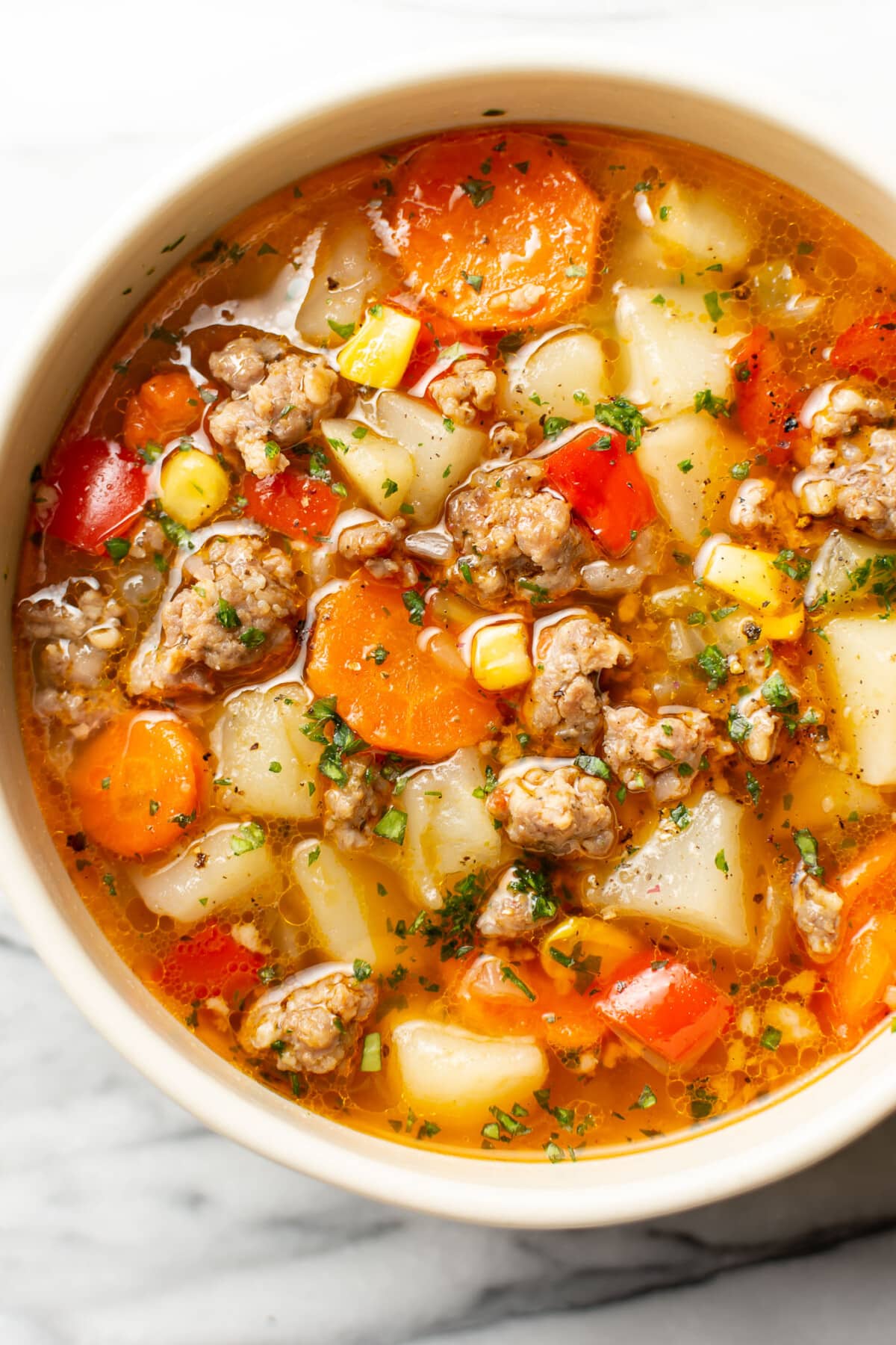 a bowl of sausage and vegetable soup