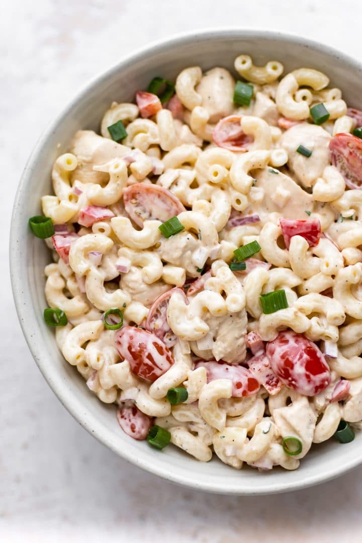 close-up of white bowl with Cajun pasta salad made with tony chachere's creole seasoning