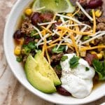 This slow cooker beef taco soup recipe is easy and delicious. Perfect for a family meal!