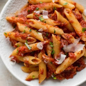 This easy Pasta Arrabiata is a traditional Italian pasta dish made of crushed tomatoes, garlic, olive oil, and red pepper flakes.