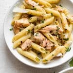 Garlic butter salmon pasta in a white bowl