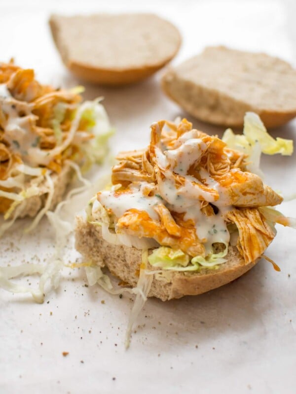 This Instant Pot buffalo chicken recipe is simple and crazy good. Your favorite hot wing flavor makes the best sandwiches. Perfect with ranch or blue cheese dressing!