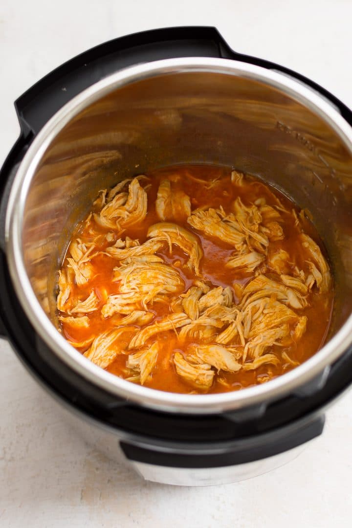 shredded buffalo chicken inside an instant pot