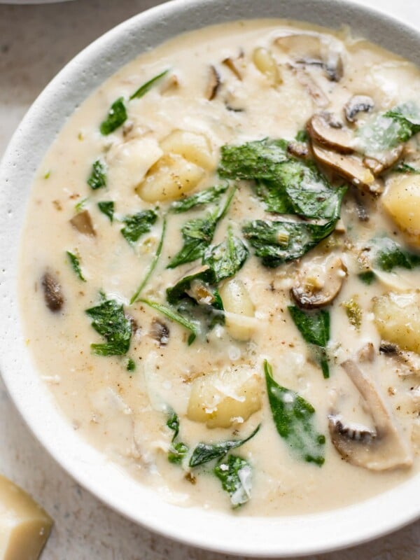 This creamy gnocchi soup with spinach, mushrooms, garlic, and a creamy broth is irresistible! Vegetarian comfort food at its finest.