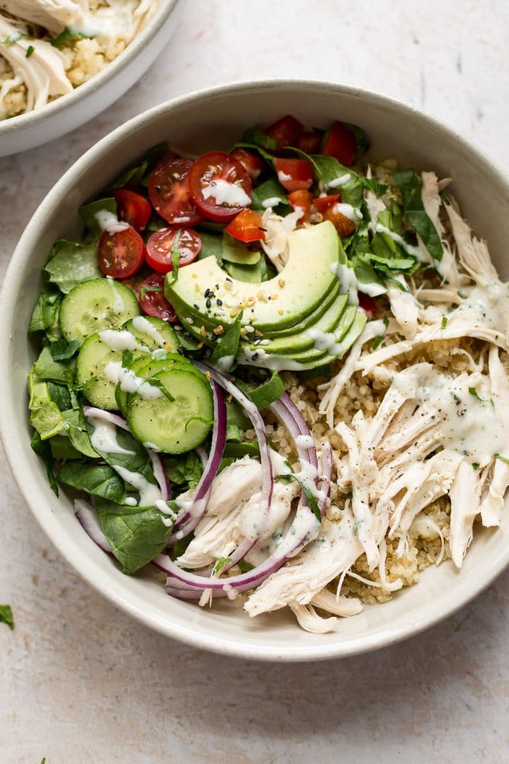 white bowl of chicken quinoa salad with leftover chicken