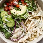 This ranch chicken quinoa salad is super simple and delicious. Avocado, red onion, tomatoes, cucumber, and a tasty homemade ranch dressing make this recipe a winner!