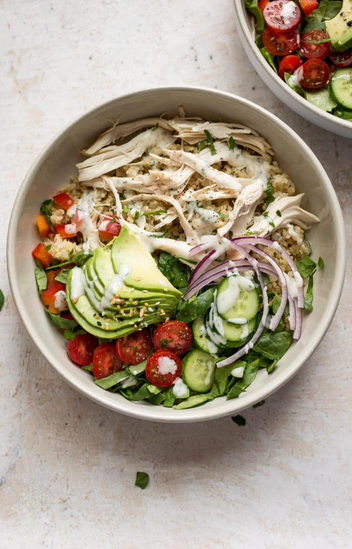 two white bowls of easy and healthy ranch chicken quinoa salad