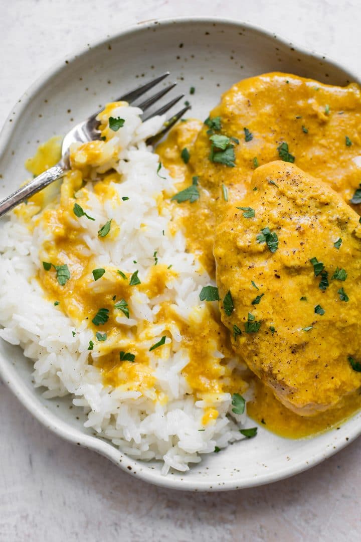 close-up of pork chops and rice on a plate