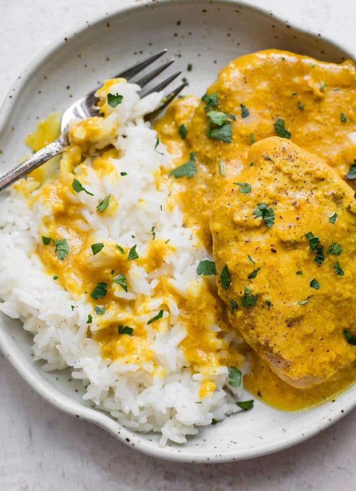Close-up of pork chops and rice on a plate