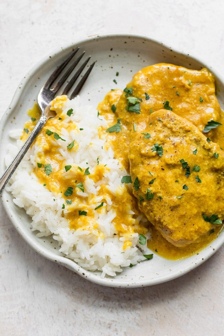 Pork chops and rice on a plate