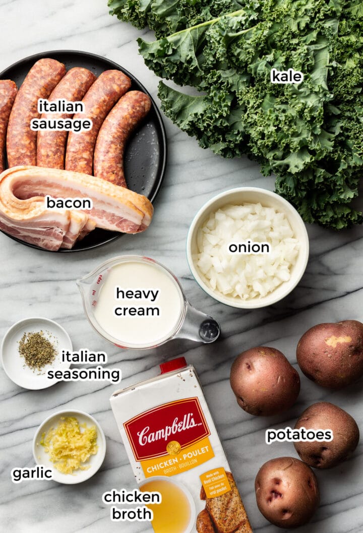 ingredients for zuppa toscana on a marble counter