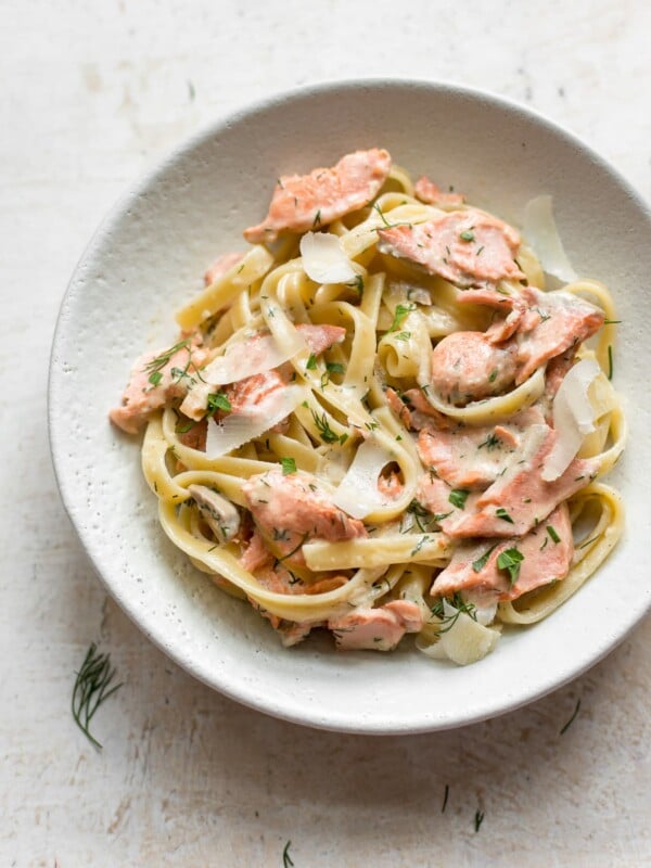 lemon dill salmon over fettuccine in a bowl