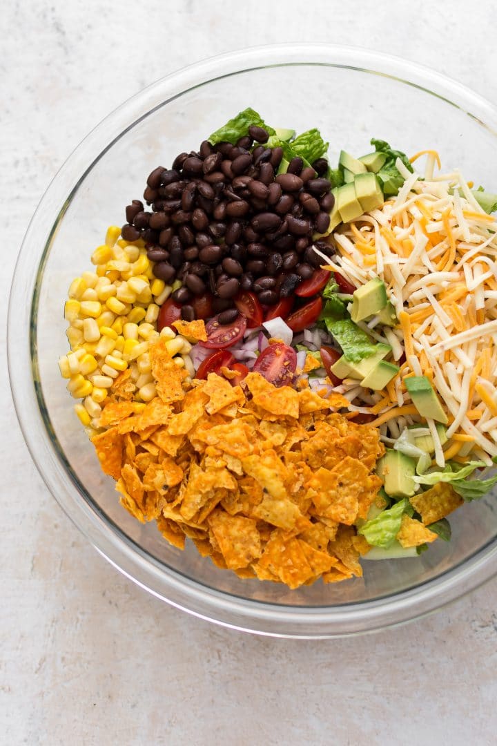 beef taco salad prep in a glass bowl