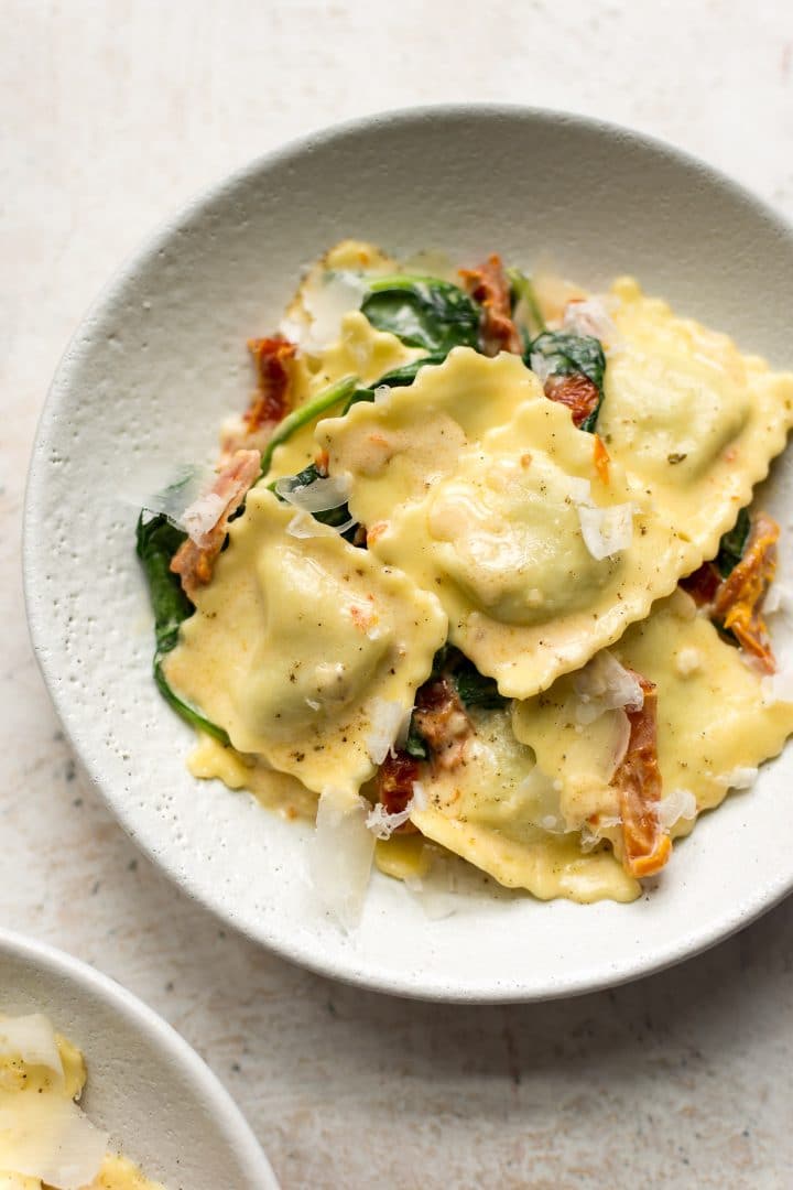 creamy tuscan ravioli in two bowls