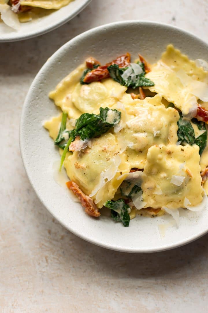 creamy tuscan ravioli in a bowl