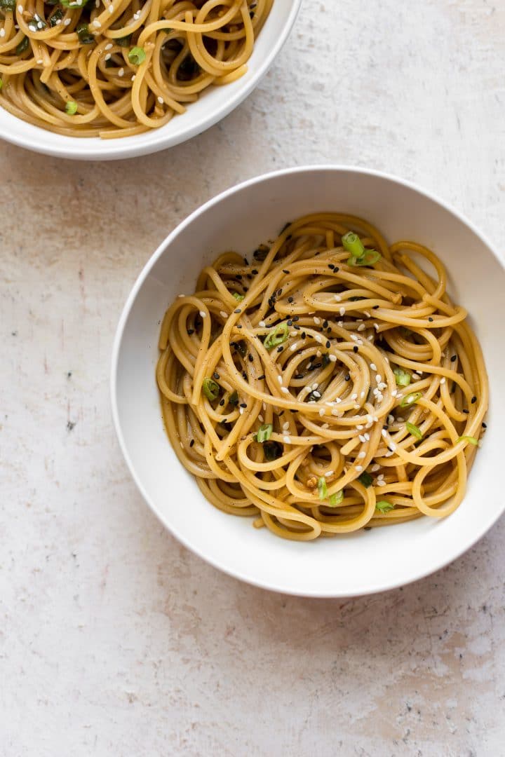 garlic ginger noodles in two white bowls