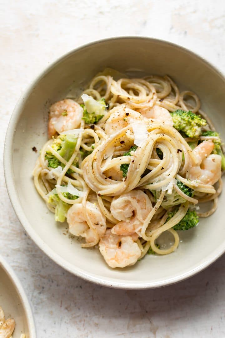 broccoli and shrimp pasta with a cream cheese sauce in a bowl