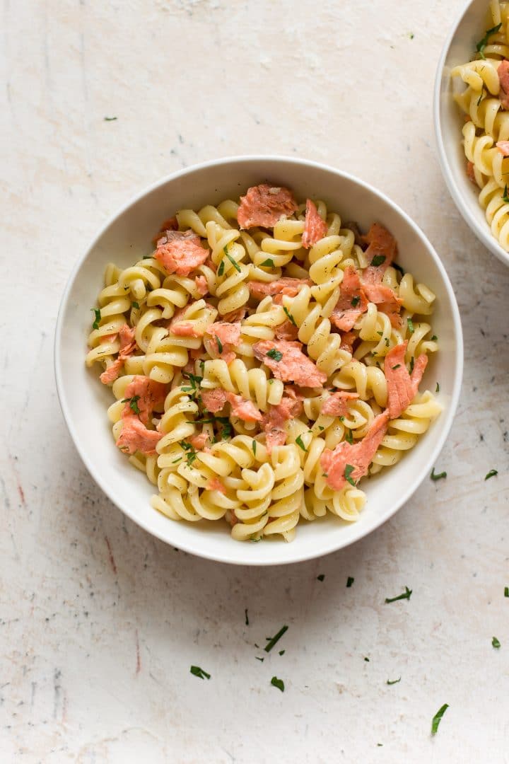 smoked salmon pasta in two white bowls