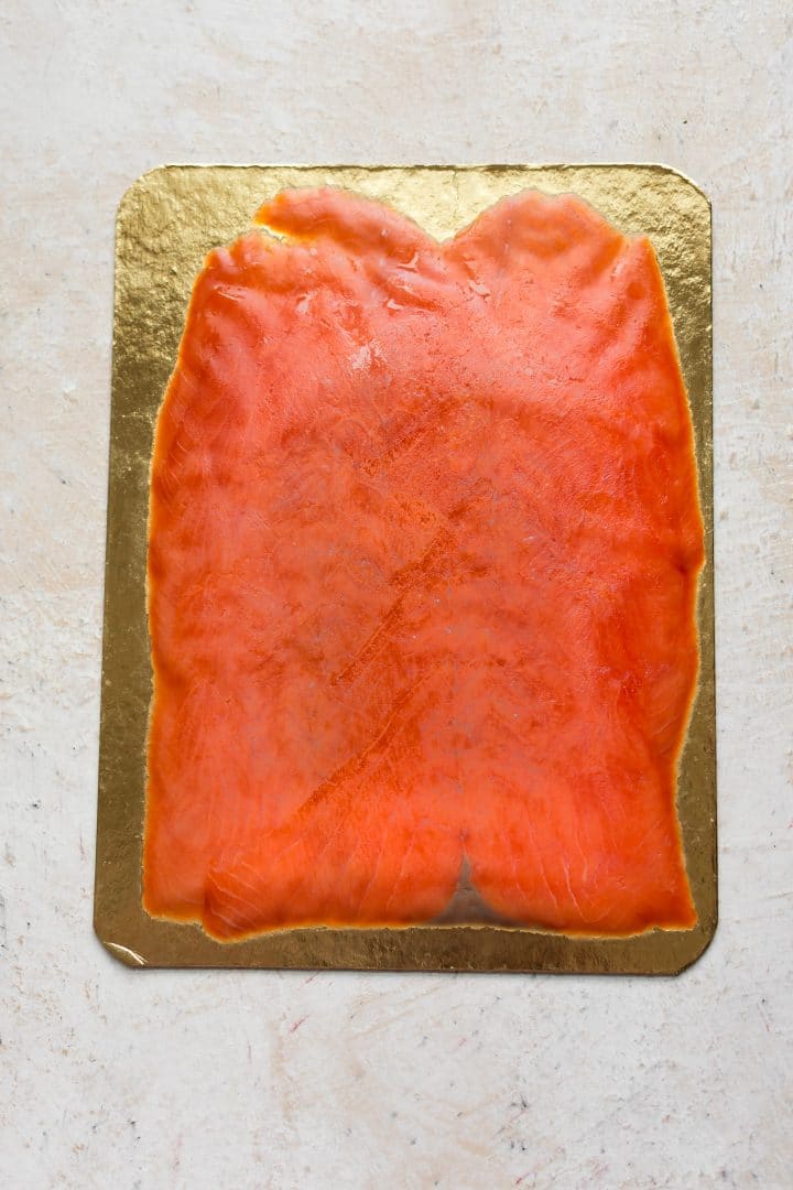 cold smoked salmon thinly sliced on gold packaging