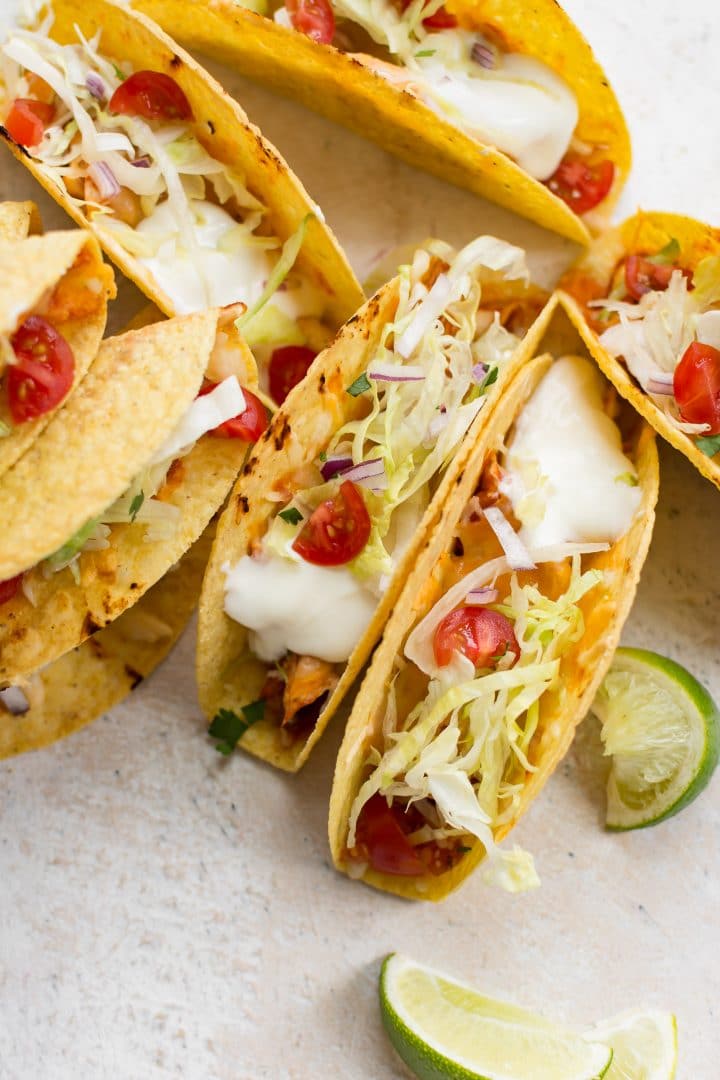 oven baked chicken tacos on a white board