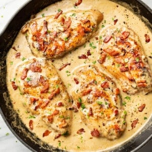 a cast iron skillet with creamy bacon chicken