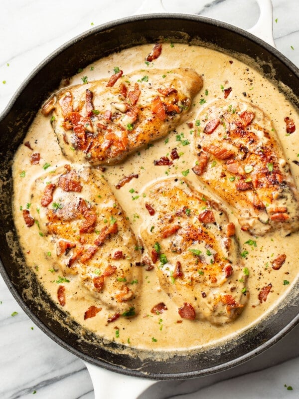 a cast iron skillet with creamy bacon chicken