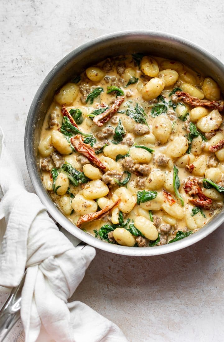 creamy sausage gnocchi in a skillet