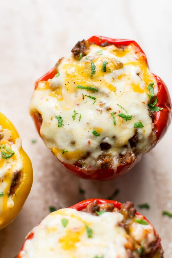 close-up of yellow and red stuffed bell peppers