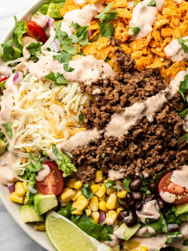 a bowl of taco salad with creamy salsa dressing