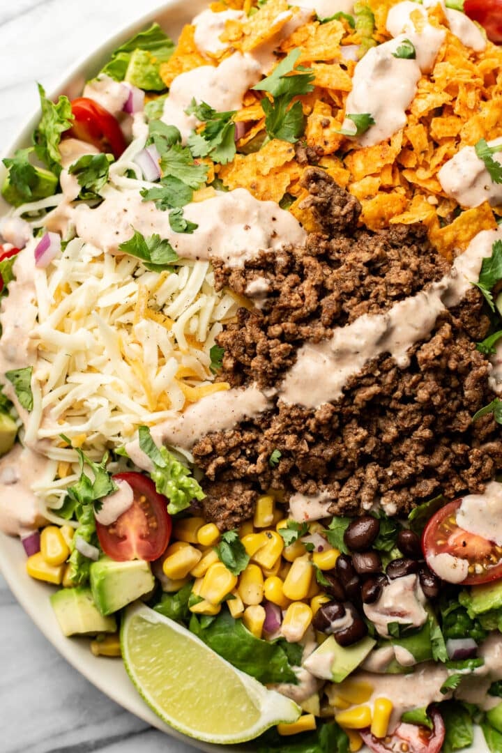 a bowl of taco salad with creamy salsa dressing