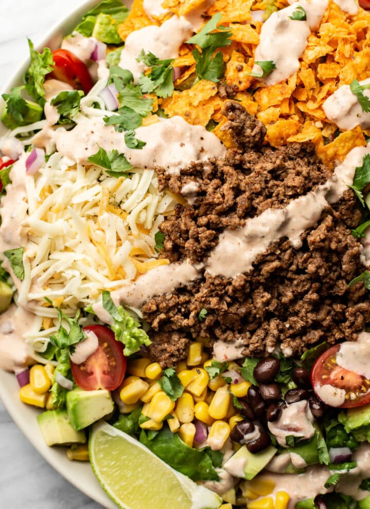 a bowl of taco salad with creamy salsa dressing