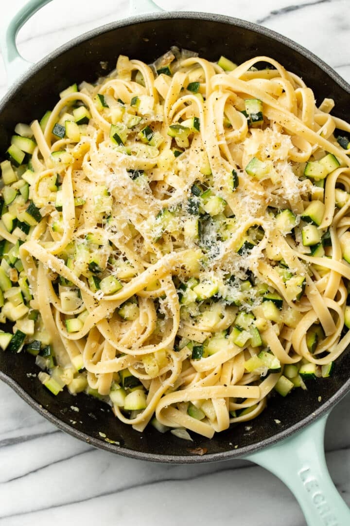 fettuccine in a skillet with fresh zucchini pasta sauce