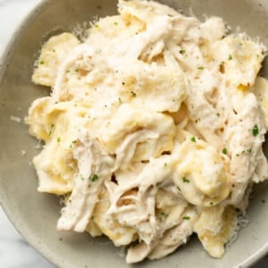 a bowl with chicken tortellini alfredo