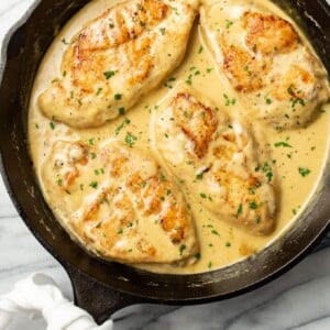 a cast iron skillet with creamy honey mustard chicken