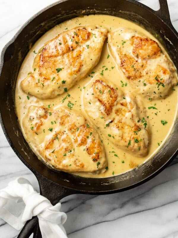 a cast iron skillet with creamy honey mustard chicken