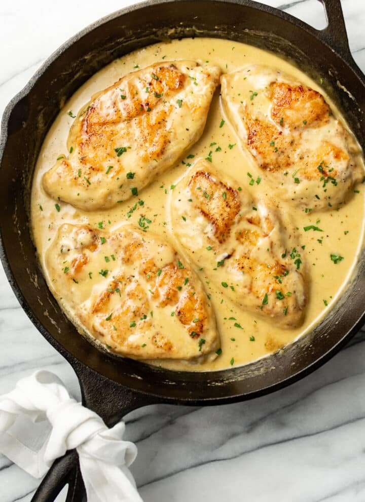 a cast iron skillet with creamy honey mustard chicken