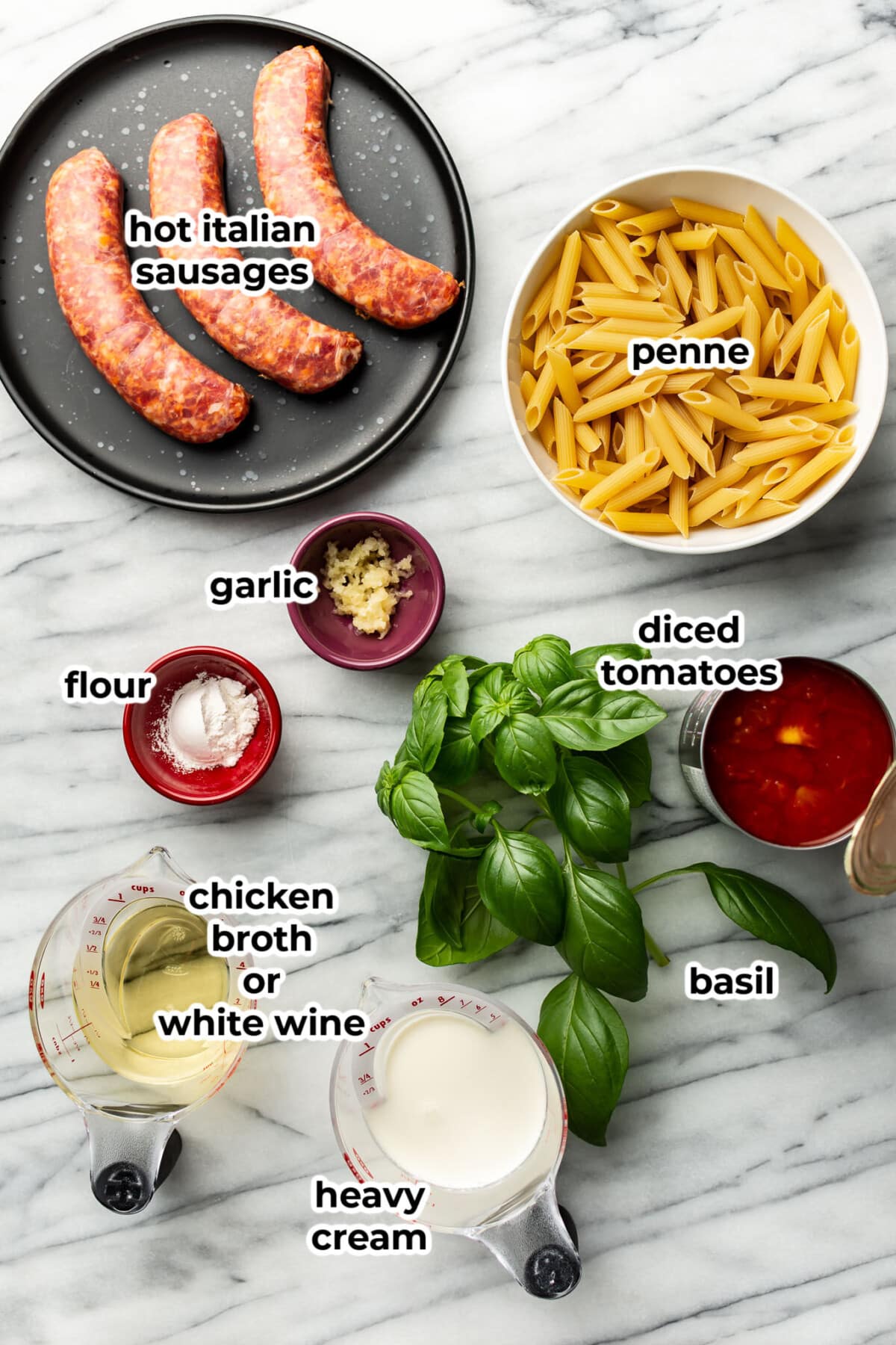 ingredients for spicy italian sausage pasta in prep bowls