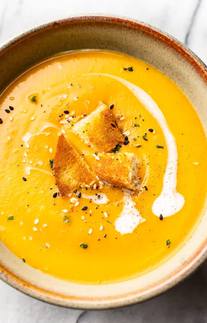 close-up of creamy butternut squash soup with coconut milk in a bowl